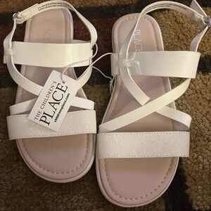 brand new children’s clothes place sandals. these sandals are size 3.